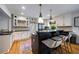 Modern kitchen with an island, stainless steel appliances, and stylish pendant lighting at 305 Montevallo Dr, Atlanta, GA 30342