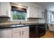 Close up of stylish kitchen with stainless steel appliances and modern fixtures at 305 Montevallo Dr, Atlanta, GA 30342