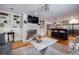 Open-concept living room and kitchen area with hardwood floors and modern finishes at 305 Montevallo Dr, Atlanta, GA 30342