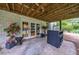 Covered patio featuring a bar with seating and walk-out to the lawn at 305 Montevallo Dr, Atlanta, GA 30342