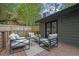 Relaxing back deck with comfortable seating, perfect for outdoor entertaining and enjoying the surrounding nature at 3165 Brookview Dr, Marietta, GA 30068