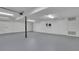 Spacious basement with white walls and gray floors, offering ample space for storage or recreation at 3165 Brookview Dr, Marietta, GA 30068