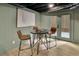 Cozy dining area features modern table set and stylish decor against light green walls and hardwood flooring at 3165 Brookview Dr, Marietta, GA 30068
