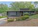 Contemporary home with modern design elements and mature landscaping at 3165 Brookview Dr, Marietta, GA 30068