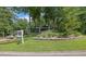 Charming home with a lush front yard and mature trees, creating a welcoming curb appeal at 3165 Brookview Dr, Marietta, GA 30068