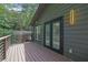Exterior view of a house featuring a well-kept deck with a door that opens up into the house at 3165 Brookview Dr, Marietta, GA 30068