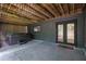 Back patio with a relaxing hot tub and stylish doors to the home's interior, with a nice under deck ceiling at 3165 Brookview Dr, Marietta, GA 30068