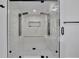 This spacious glass shower has dual shower heads, white marble tile, and a hexagon-tiled floor at 3165 Brookview Dr, Marietta, GA 30068