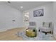 Relaxing sitting area with neutral decor, hardwood floors, and easy access to a bathroom at 3165 Brookview Dr, Marietta, GA 30068