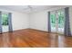 Bedroom with hardwood floors and french doors leading to a porch at 3916 Ridgewood Se Dr, Smyrna, GA 30080