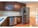 Kitchen featuring stainless steel appliances, wood cabinets, and hardwood floors at 3916 Ridgewood Se Dr, Smyrna, GA 30080