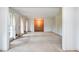 An open living room design with large windows, dated curtains and neutral colored carpeting at 3916 Ridgewood Se Dr, Smyrna, GA 30080