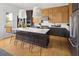 Contemporary kitchen with a large island, seating, stainless steel appliances, and bright countertops at 4850 Summerchase Ln, Cumming, GA 30028