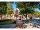 Charming street view with red awnings, landscaped areas, and pedestrian walkways at 4850 Summerchase Ln, Cumming, GA 30028