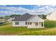 Lovely home with an outdoor patio, and a well-manicured backyard at 648 Kimberwick Dr, Locust Grove, GA 30248