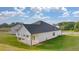 Beautiful backyard with well maintained lawn and covered patio at 648 Kimberwick Dr, Locust Grove, GA 30248