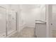 Bathroom with a tub, shower, and double sink vanity at 648 Kimberwick Dr, Locust Grove, GA 30248