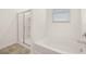Bathroom featuring a glass shower and a soaking tub at 648 Kimberwick Dr, Locust Grove, GA 30248