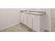 Bathroom with a double sink vanity and stone counter at 648 Kimberwick Dr, Locust Grove, GA 30248