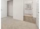 Bright bedroom with open closet, light carpet, and en-suite bathroom at 648 Kimberwick Dr, Locust Grove, GA 30248
