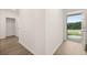 Bright entryway featuring wood-look floors and convenient access to a storage area at 648 Kimberwick Dr, Locust Grove, GA 30248