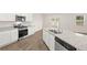 Bright kitchen with granite countertops, an island, stainless steel appliances, and ample cabinet space at 648 Kimberwick Dr, Locust Grove, GA 30248