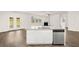 Bright kitchen island with granite countertops and stainless steel dishwasher at 648 Kimberwick Dr, Locust Grove, GA 30248