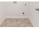 Laundry room with tiled floors and utility hookups at 648 Kimberwick Dr, Locust Grove, GA 30248