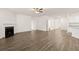 Spacious living room featuring hardwood floors and a fireplace at 648 Kimberwick Dr, Locust Grove, GA 30248