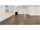 Spacious living room with a fireplace, and large windows allowing natural light at 648 Kimberwick Dr, Locust Grove, GA 30248