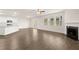 Bright living room with modern kitchen and fireplace at 648 Kimberwick Dr, Locust Grove, GA 30248
