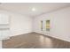 Bright living area with double doors providing access to the outdoor space at 648 Kimberwick Dr, Locust Grove, GA 30248