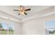 Bright primary bedroom features a tray ceiling, and large windows for ample natural light at 648 Kimberwick Dr, Locust Grove, GA 30248