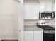 Kitchen with pantry featuring wire shelving, stainless steel appliances, and granite counters at 648 Kimberwick Dr, Locust Grove, GA 30248