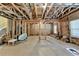 Spacious unfinished basement with exposed ceiling and framed walls offers potential for future expansion and personalization at 12095 Cameron Dr, Duluth, GA 30097