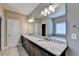Elegant bathroom with double vanity, granite countertop, and soaking tub at 12095 Cameron Dr, Duluth, GA 30097