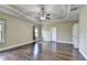 Spacious bedroom boasting hardwood floors, tray ceiling, and a ceiling fan at 12095 Cameron Dr, Duluth, GA 30097