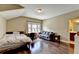 Spacious bedroom with hardwood floors, natural light, and an ensuite bathroom at 12095 Cameron Dr, Duluth, GA 30097
