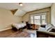 Bedroom featuring hardwood floors, natural light, and comfortable seating at 12095 Cameron Dr, Duluth, GA 30097