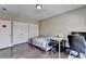 Bedroom boasts hardwood floors, two closets and a work desk for a comfortable living space at 12095 Cameron Dr, Duluth, GA 30097