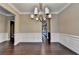 Bright dining room featuring an open floor plan and elegant trim at 12095 Cameron Dr, Duluth, GA 30097