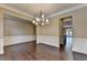 Formal dining space with beautiful hardwood floors and classic wainscoting at 12095 Cameron Dr, Duluth, GA 30097