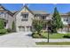 Charming two-story home with stone accents, covered porch, and manicured landscaping at 12095 Cameron Dr, Duluth, GA 30097