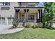 Inviting front porch with stone accents and decorative columns, enhancing the curb appeal at 12095 Cameron Dr, Duluth, GA 30097