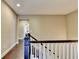 Hallway boasts hardwood floors and neutral colored walls, with a view to the rooms nearby at 12095 Cameron Dr, Duluth, GA 30097