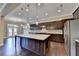 Spacious kitchen featuring a large island, stainless steel appliances, and dark wood cabinetry at 12095 Cameron Dr, Duluth, GA 30097