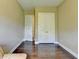 Compact, versatile room space, featuring hardwood floors and bright natural light at 12095 Cameron Dr, Duluth, GA 30097