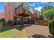 Home with multiple level patios and deck space, a well manicured lawn, and beautiful landscaping at 1667 Wehunt Se Pl # 11, Smyrna, GA 30082