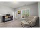 Relaxing bedroom with an oversized chair and ottoman and lots of natural light at 1667 Wehunt Se Pl # 11, Smyrna, GA 30082