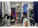 Walk-in closet with custom shelving and hanging space for optimal storage and organization at 1667 Wehunt Se Pl # 11, Smyrna, GA 30082
